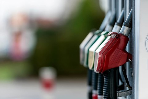 Petrol pump with nozzles at a petrol station