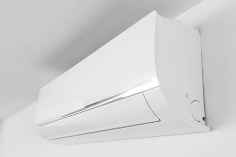 Indoor Air conditioner unit mounted on wall used for heating or cooling a space. Domestic system
