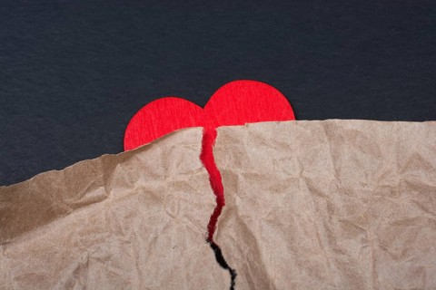Heart with torn paper for love care concept symbol