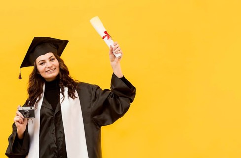 Graduate student with camera diploma