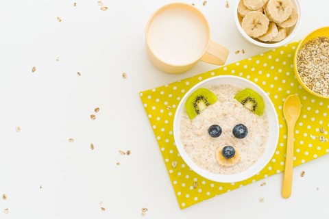 Copy space milk oat flakes with fruits