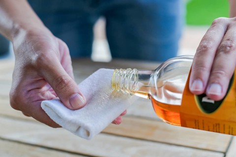 Impregnate wooden table with oil