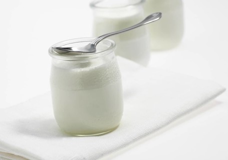 Glasses of Natural Yoghurt against White Background