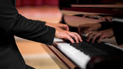 Man having classical piano recital