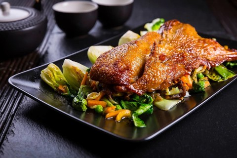 Delicious Peking duck breast with pak choi and vegetables