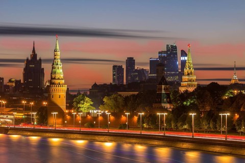 Moscow Kremlin, Moscow city business center and Moscow river at pink sunset