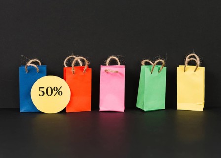 Bright packets with sale label