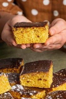 Close up hands holding delicious cake