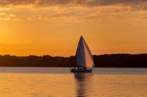 Evening mood, sunset with sailboat on the Flensburg Fjord, view to the Danish coast, Glücksburg,