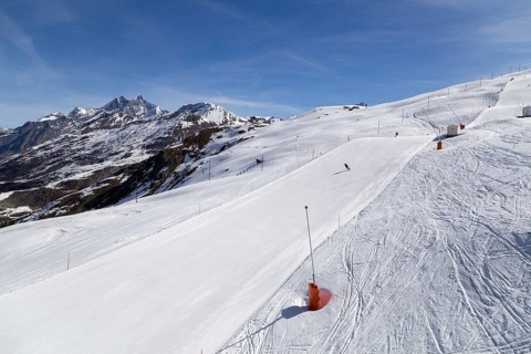 Zermatt, Switzerland, April 12, 2017: Unrecognisable people skiing on an almost empty ski piste in