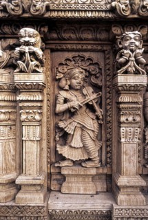 Playing Violin, 17th century wooden carvings in Meenakshi-Sundareswarar temple Chariot at Madurai,