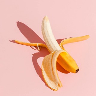 Top view banana pink background. Beautiful photo