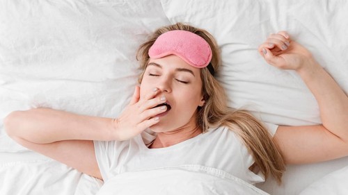 Woman yawning being sleepy
