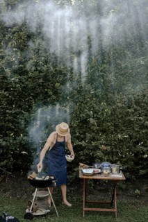 Man barbecuing in the garden