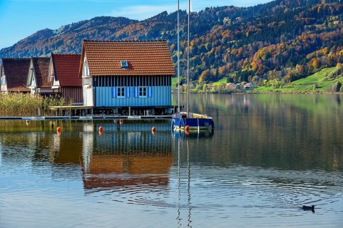 Boathouses on the large Alpsee lake near Bühl, Immenstadt Im Allgäu, Upper Allgäu, Bavaria,