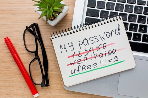 Flat lay notebook with password laptop