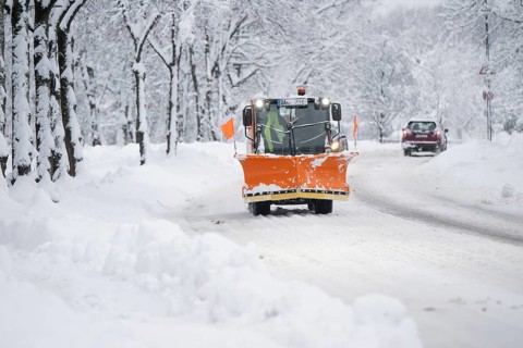 Snow plough on a snow-covered road, Daglfing, Munich, Bavaria, Germany, Europe