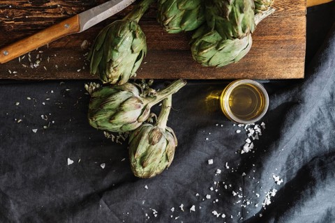 Artichokes glass oil. High resolution photo