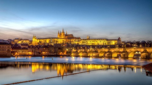 Prague, Czech Republic, March 15, 2017: Evening sunset view of Prague Castle and Charles Bridge,