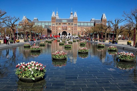 Tulip decorations reflected in the fountain in front of the Rijksmuseum in Amsterdam, Netherlands