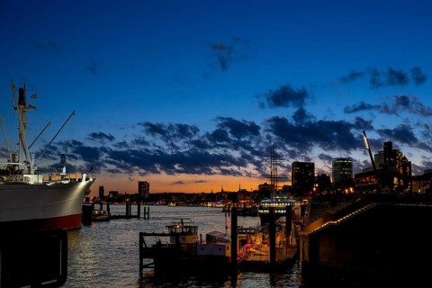 View from the Elbe promenade to the Landungsbrücken, museum ship Cap San Diego, blue hour with