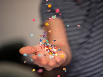 Carnival & Party Throwing Confetti in the Air