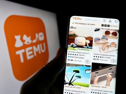 Stuttgart, Germany, 03-17-2023: Person holding cellphone with website of US online shop company