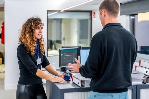 Two casual members of a hospital management talking in the office of the clinic