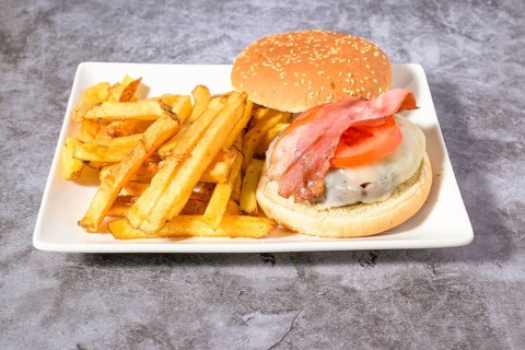 Hamburger plate with egg, bacon and french fries