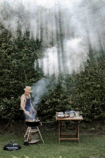 Man barbecuing in the garden