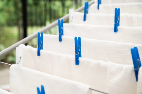 White towels drying clotheshorse