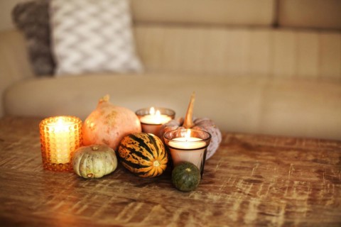Rustic style wooden coffee table in living room interior background, embellished with small