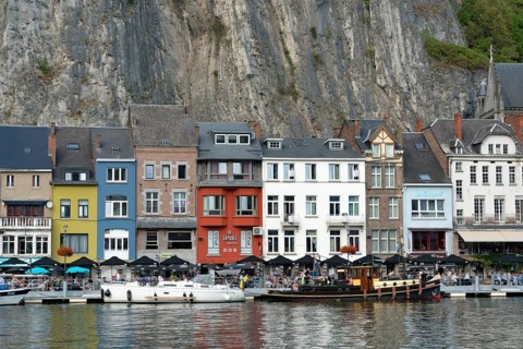 Belgium - 11 August 2019: horizontal view of the Meuse River and the historic old riverside town of
