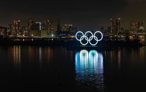 A picture of the illuminated Olympic Rings on display at the Tokyo Bay, at night