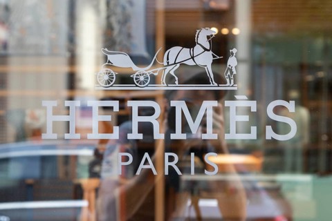 Close-up, logo of the French luxury fashion brand Hermes on a boutique in the shopping street Neuer