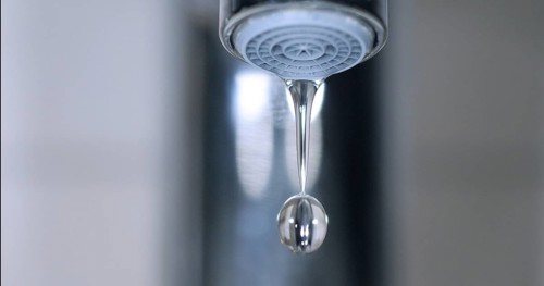 Water Flowing from the Tap, making a drop of water
