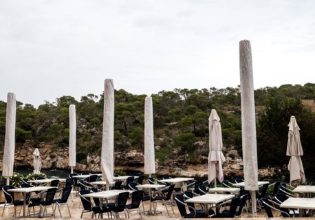 Empty restaurant terrace in the low season in Cala Figuera near Santanyí, Majorca, Balearic