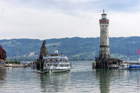 Bavarian Lion and New Lighthouse at the harbour entrance and the ship Swabia enters the harbour,