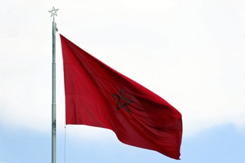 Moroccan national flag, Morocco, The Moroccan flag flies in the wind against a clear sky, The