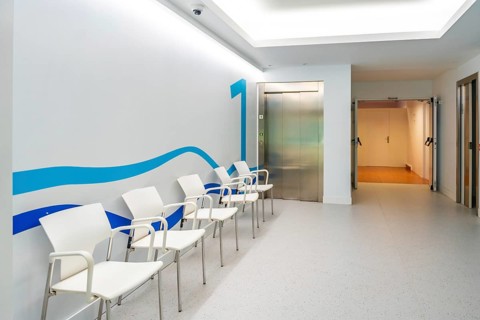 Waiting corridor with chairs in an hospital without people