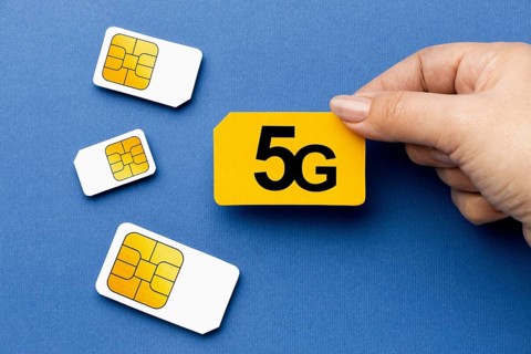 Top view hand holding 5g sim card