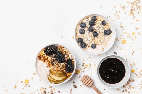 Top view mix yogurt with oats fruits honey