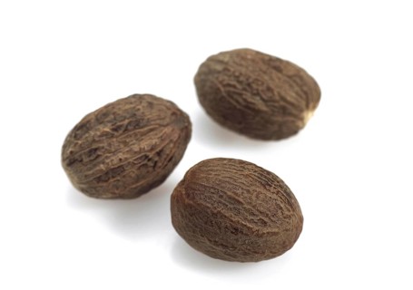 Nutmeg, myristica fragrans against White Background