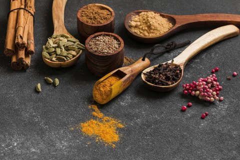 High angle wooden spoons with spices