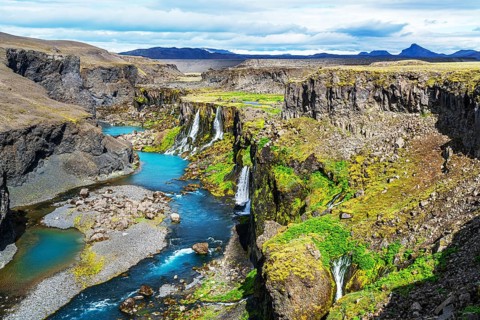 View of waterfalls in Sigoldugljufur canyon and the blue river in Highlands of Iceland in summer