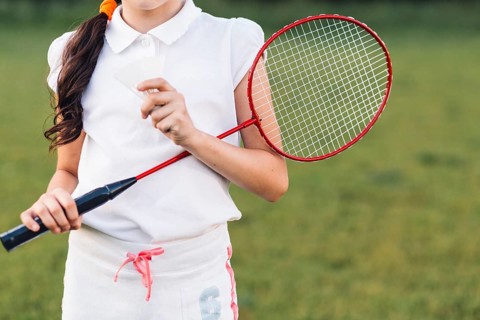 Mid section girl holding shuttlecock badminton hand