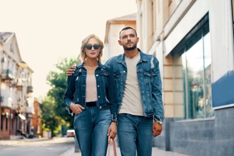 Beautiful young couple walking on the street. Love, travel, fashion and date concept