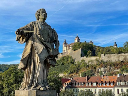 Saint Kolonat, statue, Old Main Bridge, behind Marienberg Fortress, Würzburg, Bavaria, Germany,