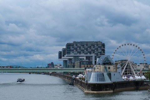 View over the Rhine with crane houses and Ferris wheel, Cologne, Germany, Europe