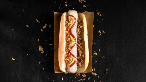 Minimalist fast food hot dog flat lay